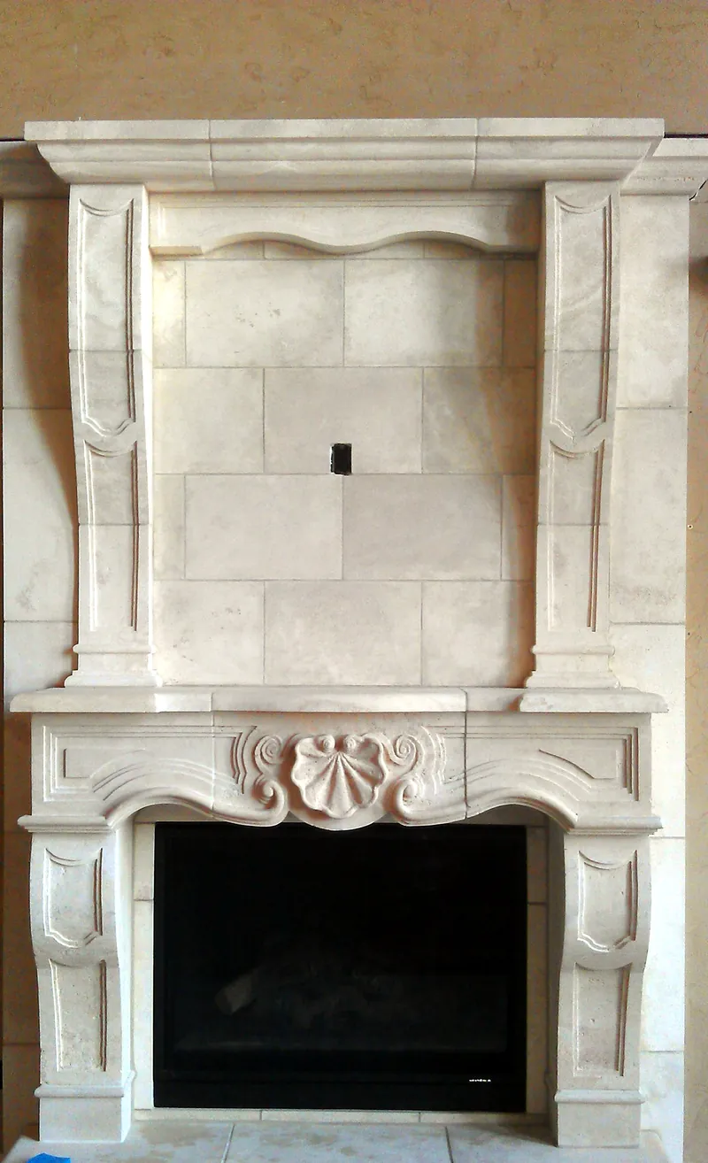 Carved stone mantel: cast-stone surround, set and grouted