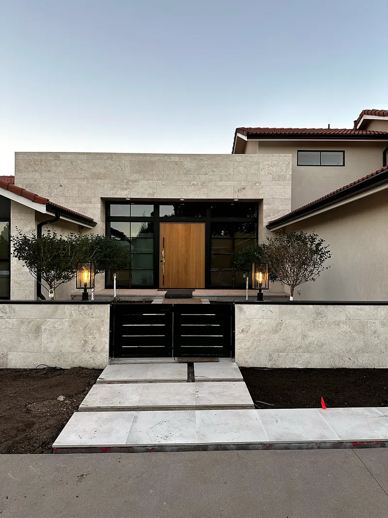 Front entry: large-format pavers and stone cladding